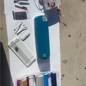 Cricut air 2 with tools and mini press and vinyls.